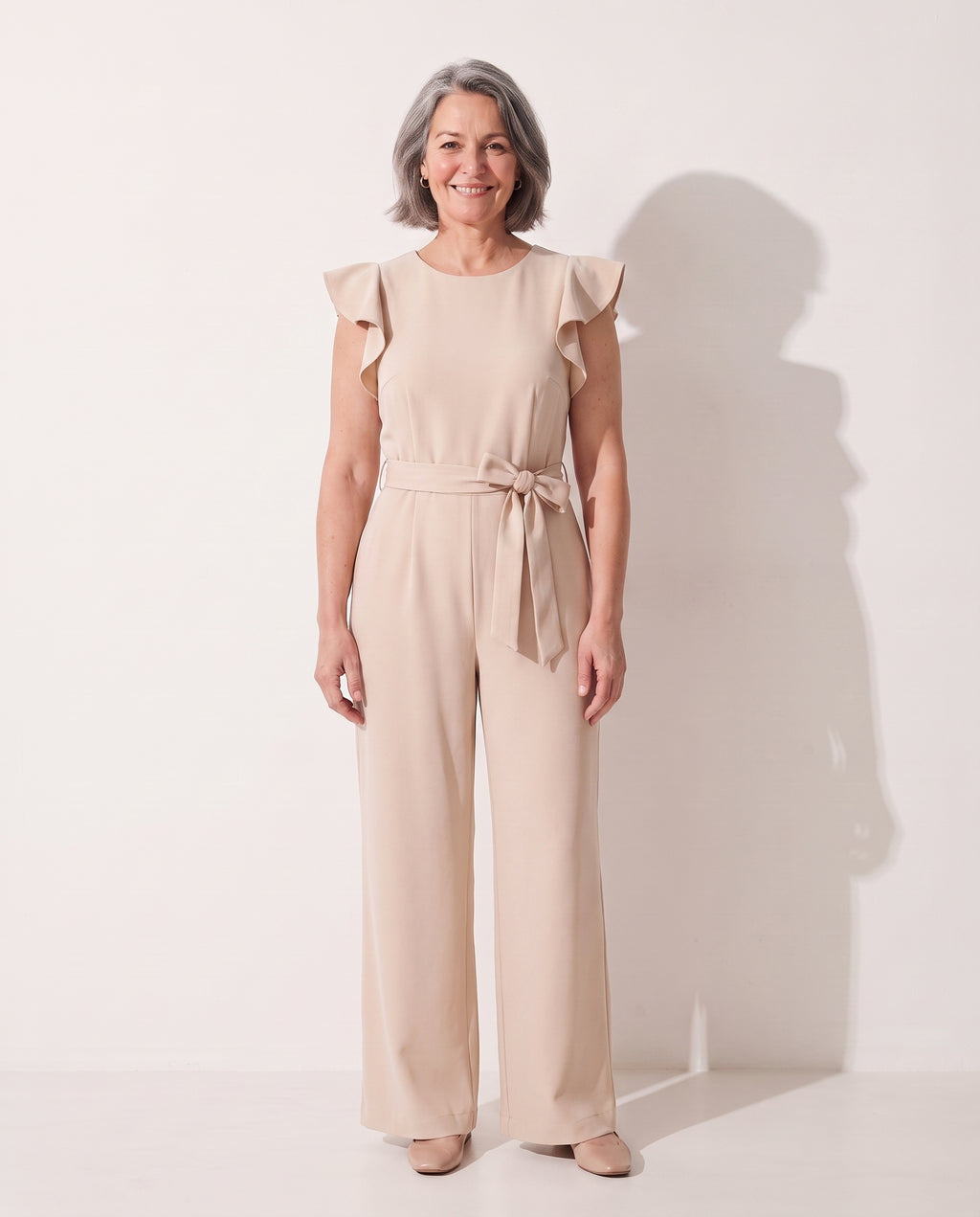 Fleur | Elegant Evening Jumpsuit With Ruffle Tie Waist Detail — Beige