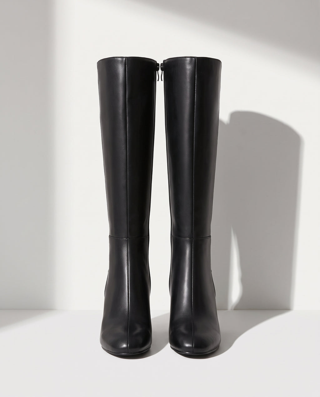 Lucinda | Black Leather Knee High Heeled Boots With Suede — voorkant