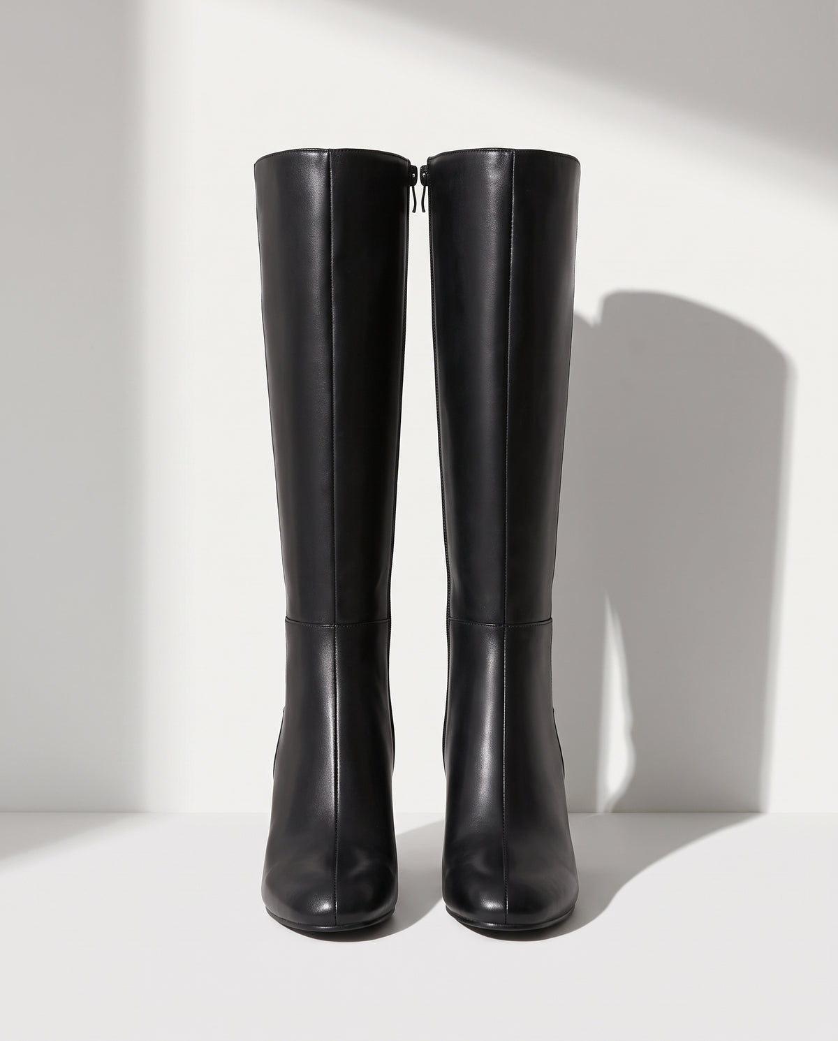 Lucinda | Black Leather Knee High Heeled Boots With Suede — voorkant